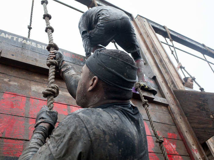 After a short run, the team came to "Balls To The Wall," a pretty straightforward rope-climb over a wall. There was a long line before the team could go however, which left the team shivering while they waited.