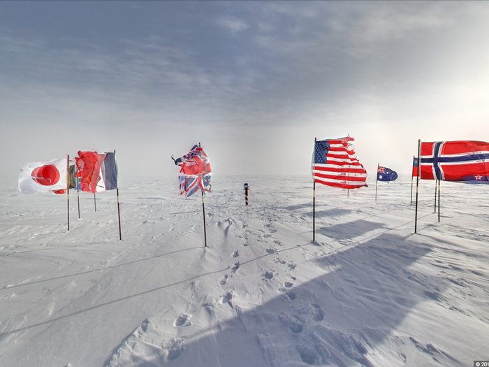 This is the ceremonial South Pole, encircled by the 12 flags of the original Antarctic Treaty nations.