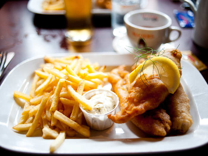 Chow down on a hearty meal of fish and chips in London, and douse it with malt vinegar—just like the locals.