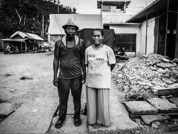 A watchtower and an outpost for wardens can be seen in the background behind this couple.