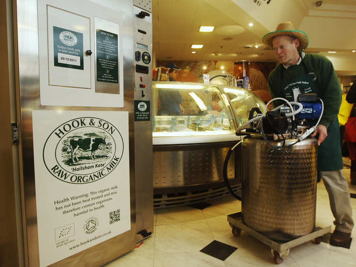 Speaking of healthy life choices, a farmer is seen below loading organic raw milk into a vending machine dispenser in central London. The vending machine was created to circumvent a ban on the sale of raw milk in British shops, by selling directly from the farm.