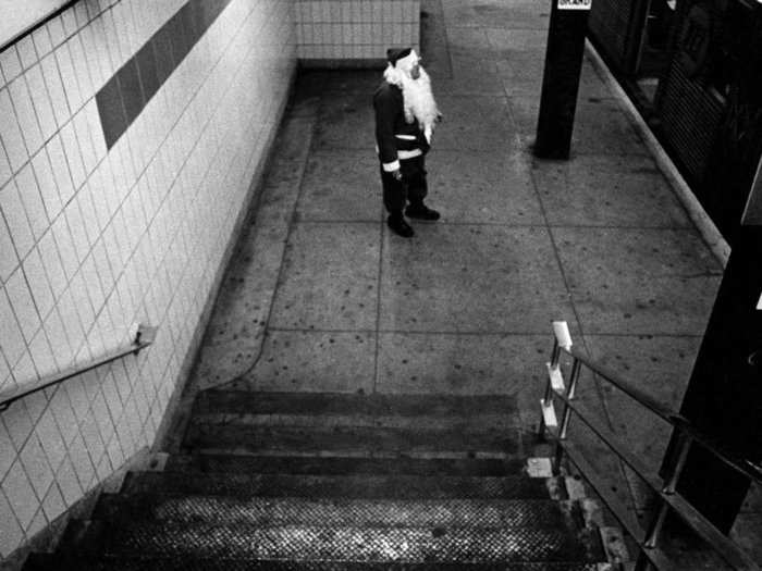 Famed street photographer Bruce Gilden captured this lonely and possibly drunk Santa waiting for the A-train in 1968.