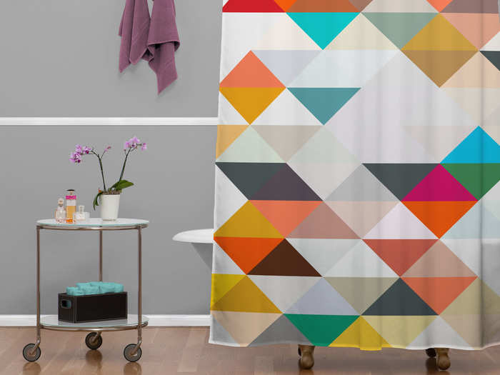 You probably already have a shower curtain, but is it the one you want? An attention-getting shower curtain, like this artistic eye-catcher from DENY Designs, can complete any bathroom aesthetic without overwhelming it.