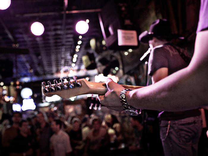 See a live country music concert at the Bluebird Cafe or Ryman Auditorium in Nashville, Tennessee.