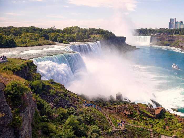 Marvel at Niagara Falls, where approximately 3,160 tons of water flows over the falls every second.