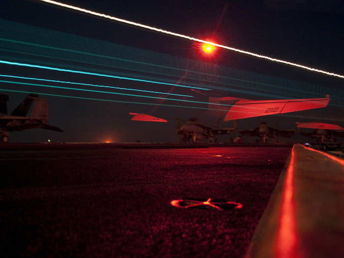 An F/A-18F Super Hornet from the Jolly Rogers of Strike Fighter Squadron (VFA) 103 launches from the Nimitz-class aircraft carrier USS Dwight D. Eisenhower.