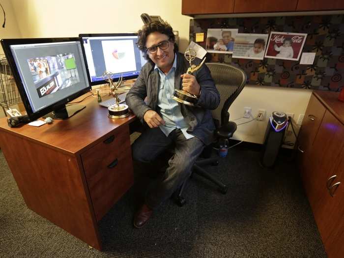 Luis Soler, 53, is seen here with the two Emmy awards he won as creative director at the Univision TV network. Soler said he spent five days adrift with other migrants in 1994 before being picked up by the U.S. Coast Guard.