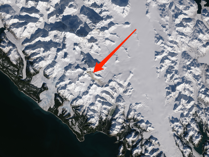 One of the largest landslides of this decade took place last February in southeastern Alaska. The landslide involved 68 million metric tons of material, and the aftermath is shown here by the brown streak smeared across the snowy background.