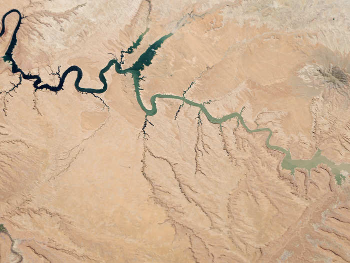 A reservoir of the Colorado River, Lake Powell stretches across the border between Utah and Arizona. Since the turn of the century it has suffered from drought and at the time this picture was taken last May, was more than half empty.