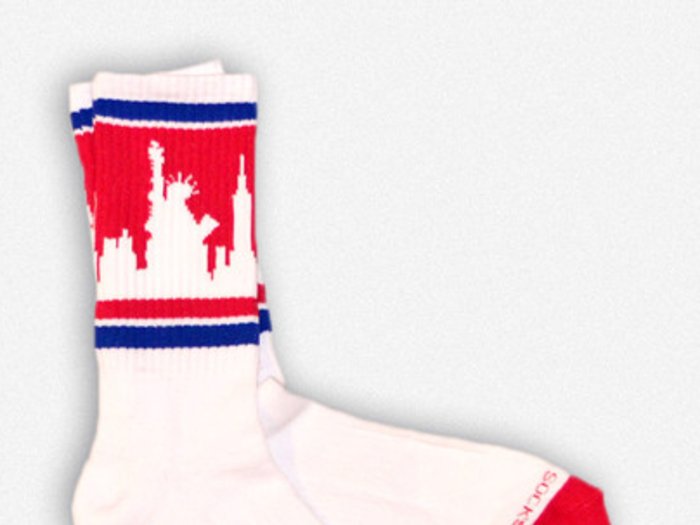 Rep your city while making needy residents more comfortable by wearing Skyline Socks.