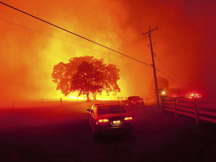 Other warming-related events are less subtle. Climate scientists predict an increase in wildfires, like this 2013 blaze near Clayton, Calif., as temperatures continue to rise.