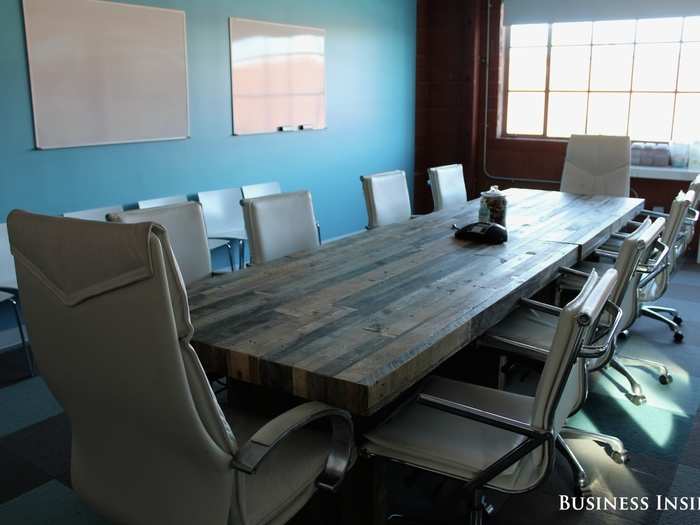 Recycled materials are a theme in this office. The table in this conference room was made from reclaimed wood.