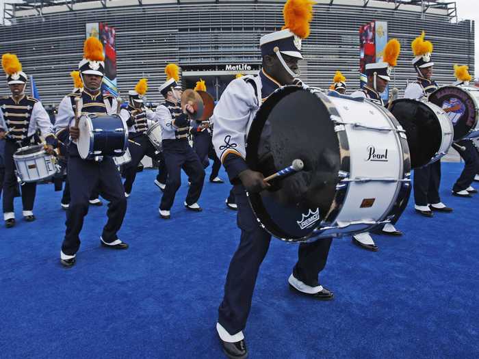 A test-taker sat by another guy with a penchant for drumming.