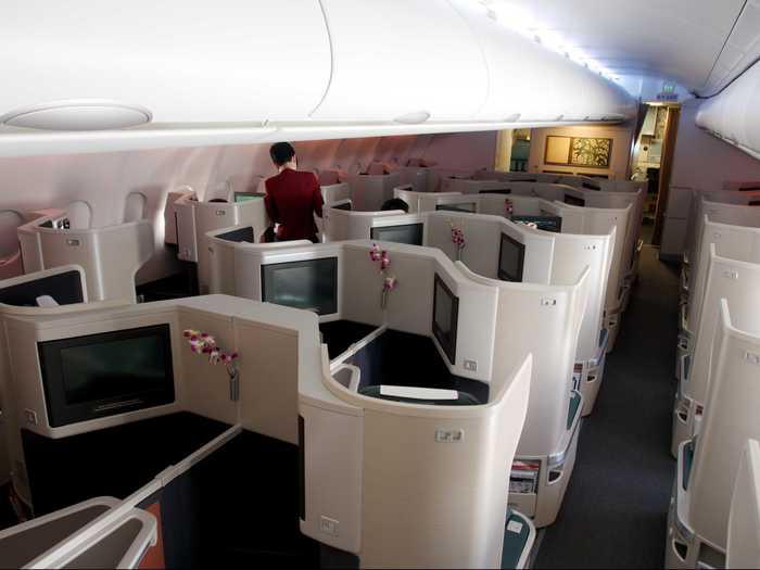 Most business class cabins on Cathay planes are arranged in a herringbone shape, which allows each seat to fully recline.