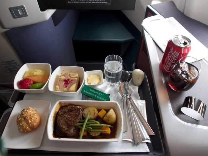 Lunch is heartier. Passengers might eat steak, potatoes, and cheesecake and fruit for dessert. Notice that meals come with real silverware and glasses, too.