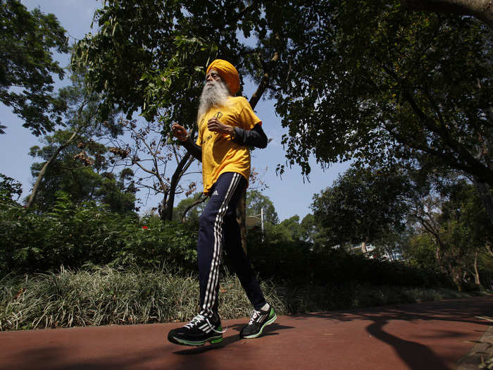 British Indian marathon runner Fauja Singh, 101, jogs during a practice at a park in Hong Kong, February, 2013. Singh took part in a 10-kilometer race at the Hong Kong Marathon that year, before officially retiring from public races.