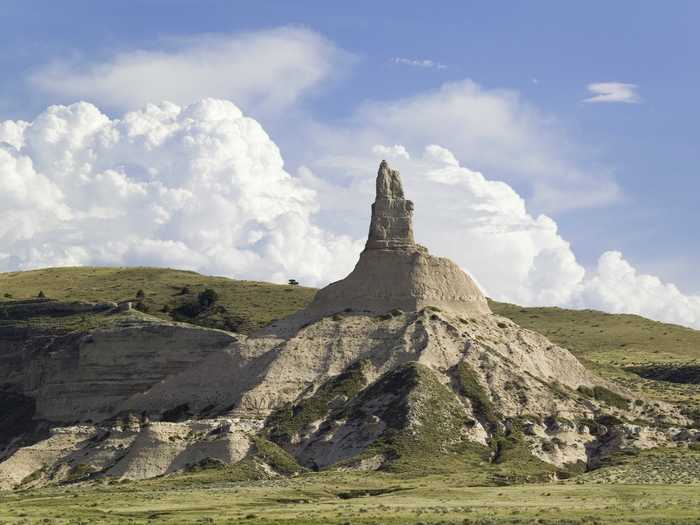 NEBRASKA: Admire Chimney Rock, a geological formation that served as a landmark along the Oregon Trail, the California Trail, and the Mormon Trail during the mid-19th century.
