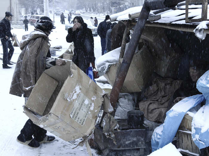 Here, women gather cardboard to burn in order to stay warm in the capital. While a fragile cease-fire still stands, there has yet to be a peace agreement, leaving the official status of Nagorno Karabakh in constant limbo.