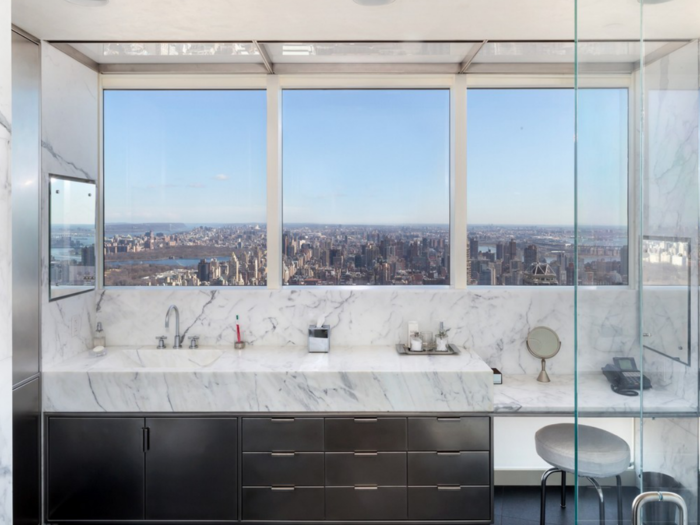 And the gorgeous bath with white marble walls and black granite floors and two dressing rooms.