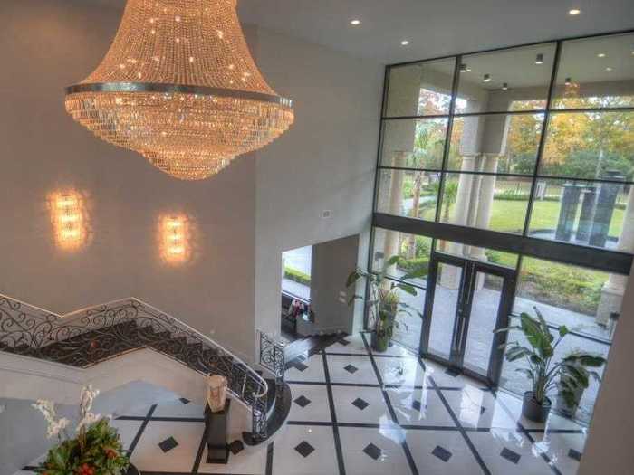 Guests are immediately greeted by a towering entryway, complete with a Swarovski Crystal chandelier.