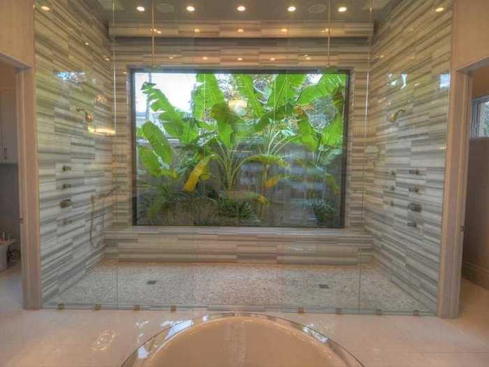 The master bath has a custom-made Italian marble shower that has duel rain heads and water jets.