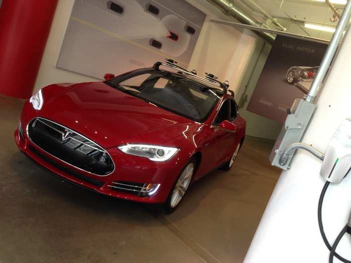 Not a Model D. Rather, a Model S with a roof rack. Teslas are so versatile!