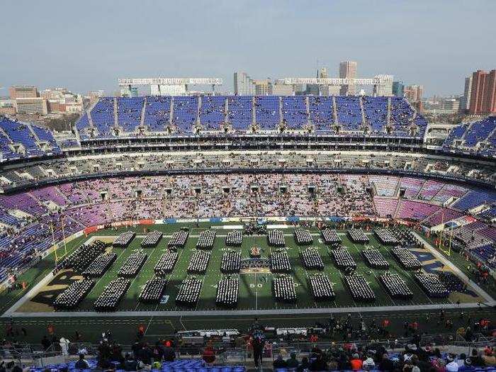 ... and take turns marching onto the field. The view is spectacular. Then the students settle into the stands as the tailgaters follow suit.