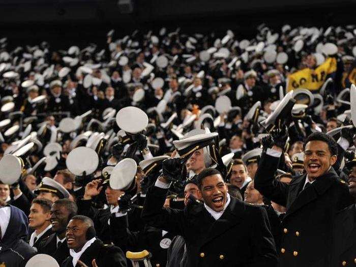 When the game is about to start, members of the Brigade shake their covers, or caps. Navy has won the game for the last 12 years.