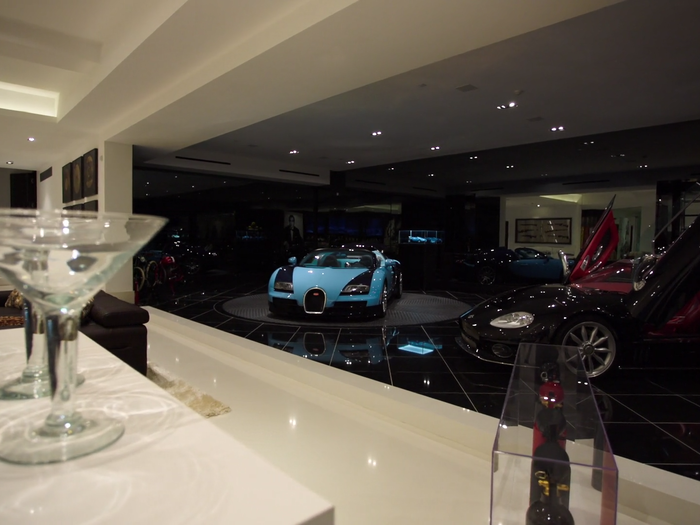 The garage opens up into a bar and living room.