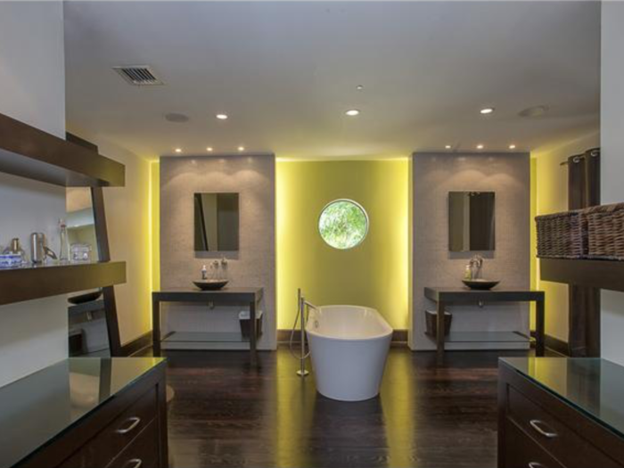 And 12.5 bathrooms, including this modern example with a tub in the middle of the room.