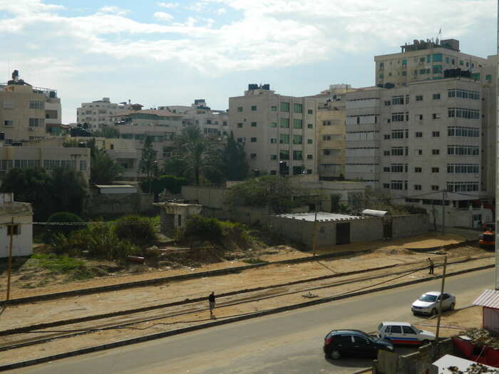 Across the street, high-rise buildings lined the half-paved road running along the Gaza City waterfront.