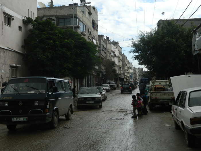 Much of the Gaza Strip looks like this: dusty and jam-packed, with late-model cars crowding the beat-up streets.