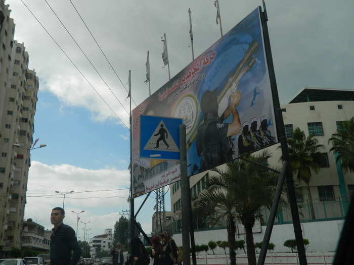 The billboards are often dedicated to fighters killed in hostilities with Israel, though some feature generic scenes of militants firing heavy weaponry.