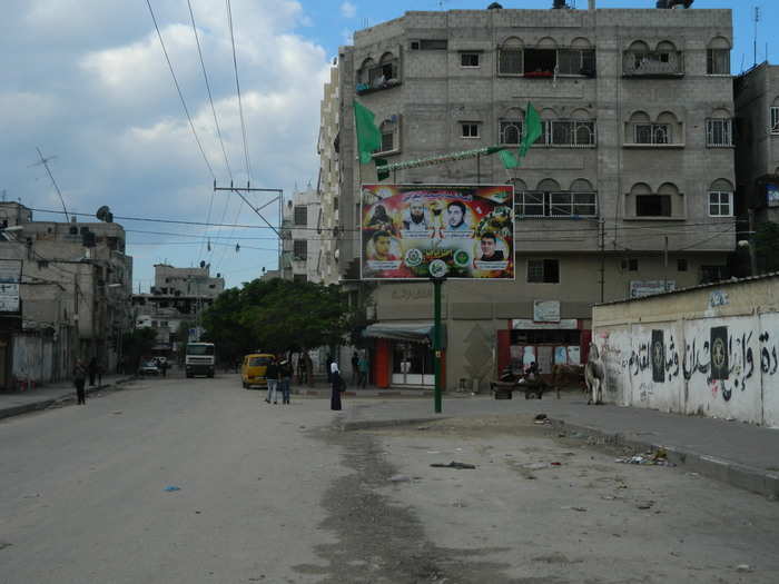 This Hamas billboard in Gaza City has a model of a Qassam rocket perched on top. Thousands of Qassams have been fired into Israel from the Strip over the past decade.