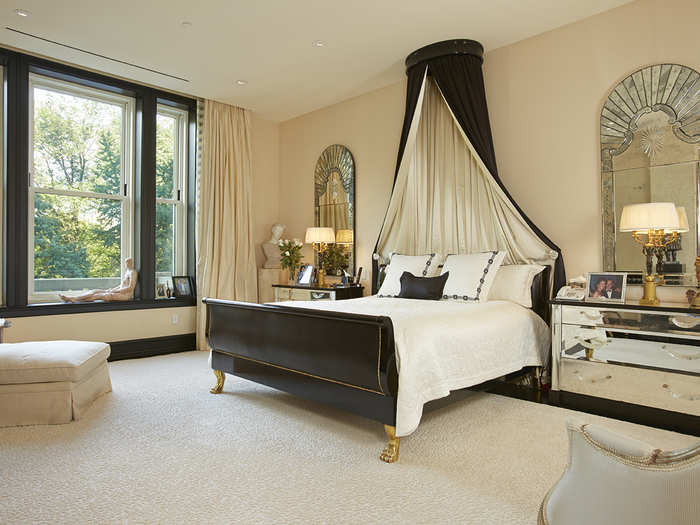 The large master suite features another grand window and two generously sized closets.