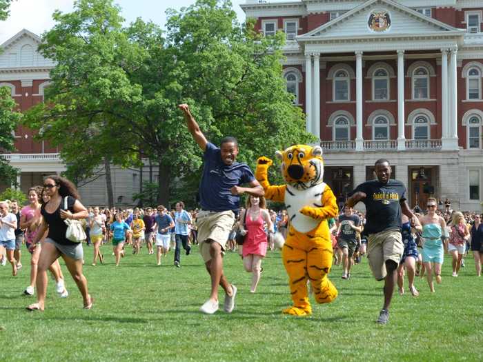 "Tiger Prowl" is a bittersweet tradition where graduating seniors run the opposite way through the columns towards the city. This is symbolic of their their exit from college and entry into the "real world." This time, professors serve beer instead of ice cream.