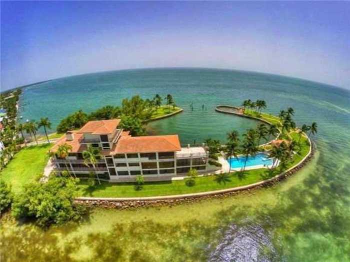 This 2-acre grand estate is located on a private peninsula overlooking Biscayne bay.