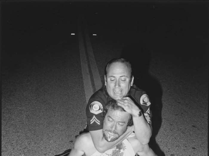 Drugs were rampant in the streets of LA at the time. Here, Agent Lee Baroni subdues a "duster," a person under the influence of PCP, after he attacked a police car.