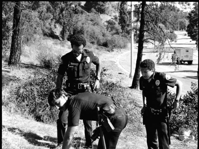 “When you are that age, you don’t realize how dangerous some situations are. You don’t worry at the time, but when you look back, you realize how bad things could have been,” says Valentine. Here, officers check on a suspect, who crashed his motorcycle during a pursuit.