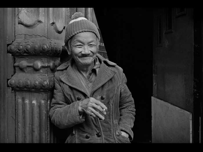 He took long walks around Chinatown, asking random strangers to take their portrait.