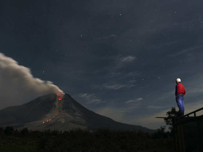 Mount Sinabung, a large volcano on Sumatra Island in Indonesia, has been erupting on and off since September of 2013, covering the area with ash and forcing thousands of people to flee their homes.