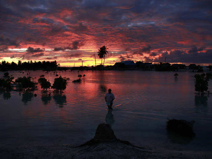 The entire island nation of Kiribati is vanishing because of global warming. On average, land in Kiribati is only six feet above sea level.