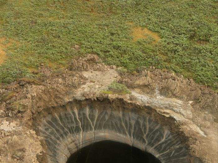 A helicopter discovered this mysterious giant crater on the Yamal Peninsula of Siberia, a place referred to as "the end of the world."