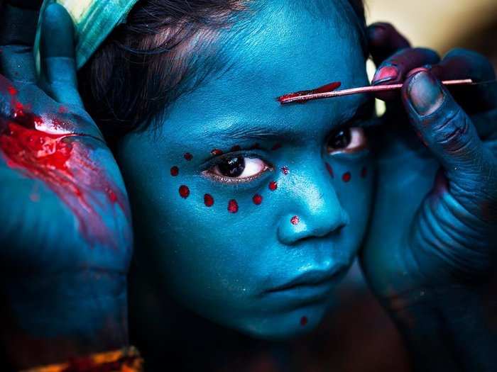 This photo was taken in a small Southern Indian village during the Mayana Soora Thiruvizha festival. The festival is devoted to Angalamman, a guardian deity worshiped in Southern India. It was the merit prize winner of the National Geographic Travelers photo contest.