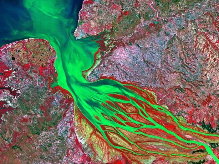 Environmentalist and aerial photographer Yann Arthus-Bertrand has collected 150 incredible images from the Betsiboka River in Madagascar emptying into Bombetoka Bay. The colors come from incorporating infrared, near-infrared, and ultraviolet light.