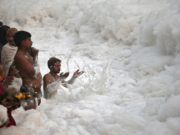 Sewage and industrial contaminants create the foam on top of India