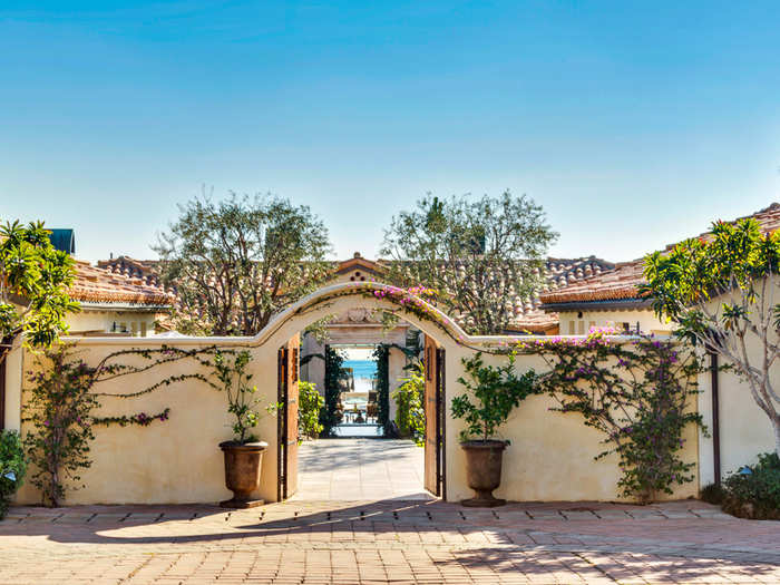 The home sits on 1.5 acres of land and has a gorgeous gate welcoming guests into the home.