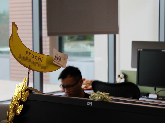 Every employee has a banana above their desk with their name on it.