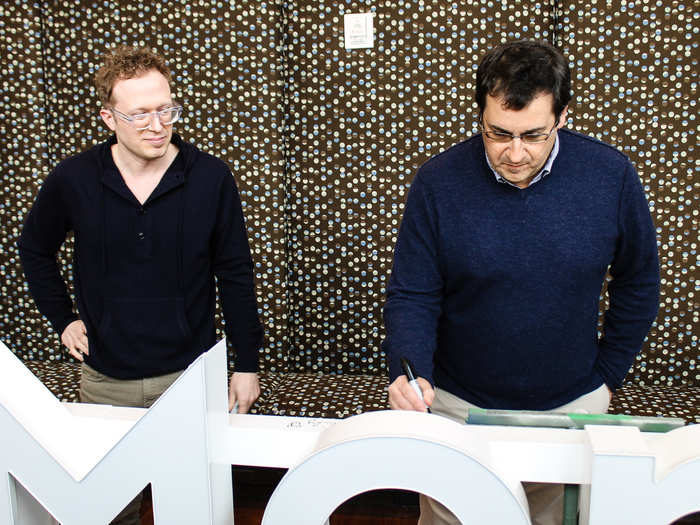 Survey Monkey founder Ryan Finley and CEO David Goldberg were the first to autograph the company