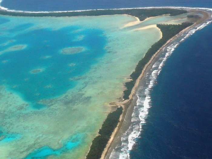 Tuvalu consists of six true atolls and three reef islands that has a population of nearly 11,000. The highest point in the country is less than five meters above sea level, and most of it is less than a meter above.